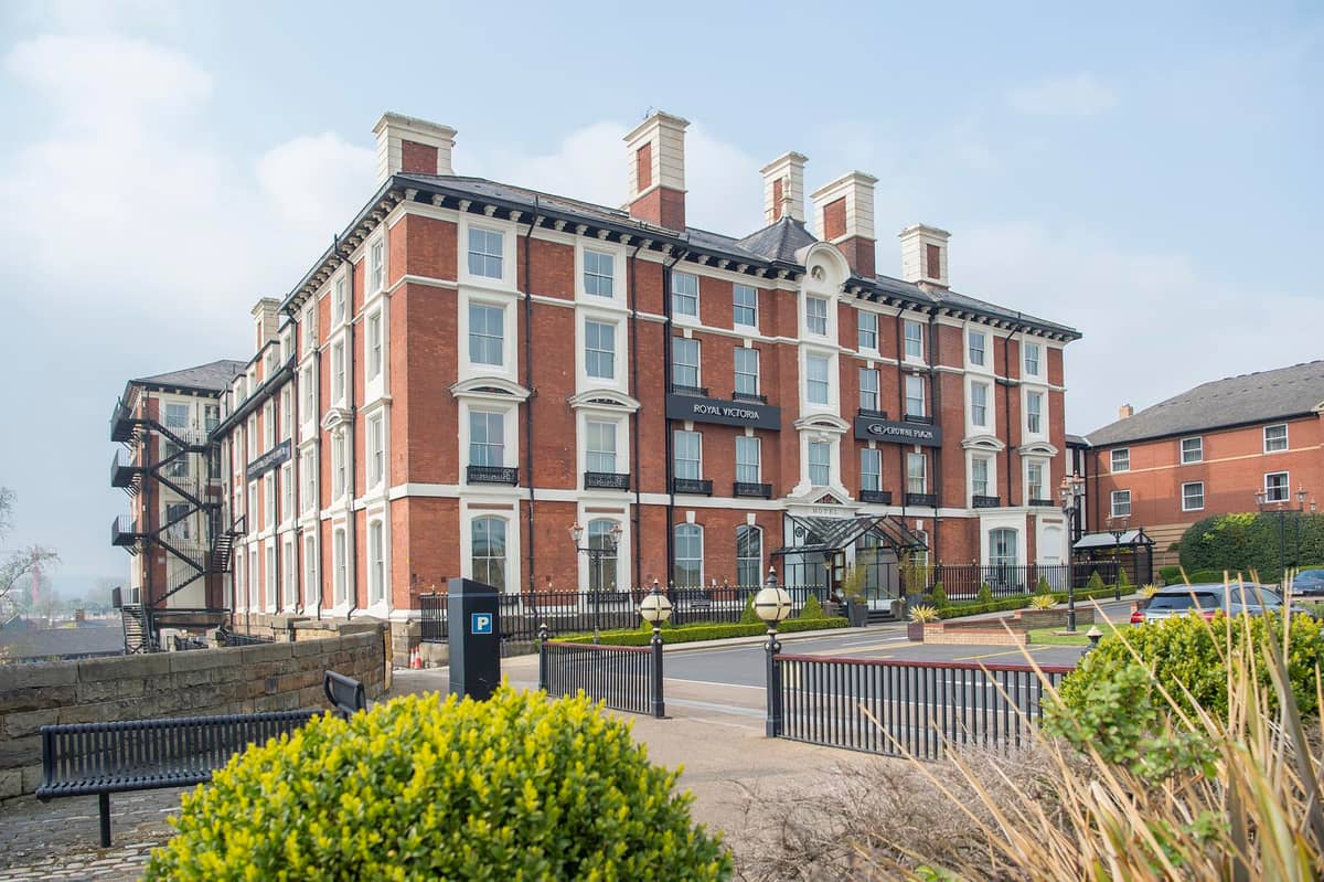 Exterior of the Crowne Plaza Royal Victoria Sheffield, a large Victorian red brick hotel.