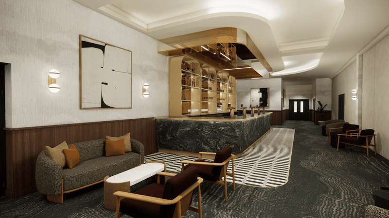 Hotel bar area with dark marble counter, gold shelving, sofas and armchairs.