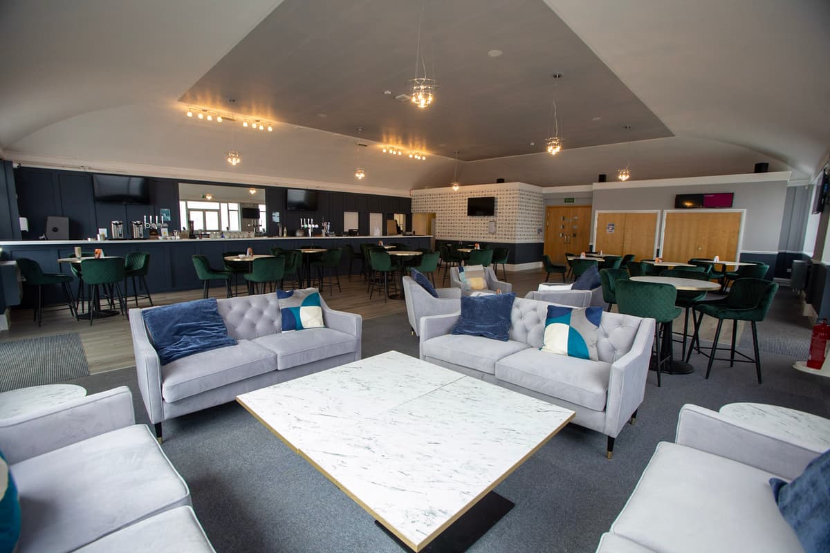 Lounge area with grey velvet sofas