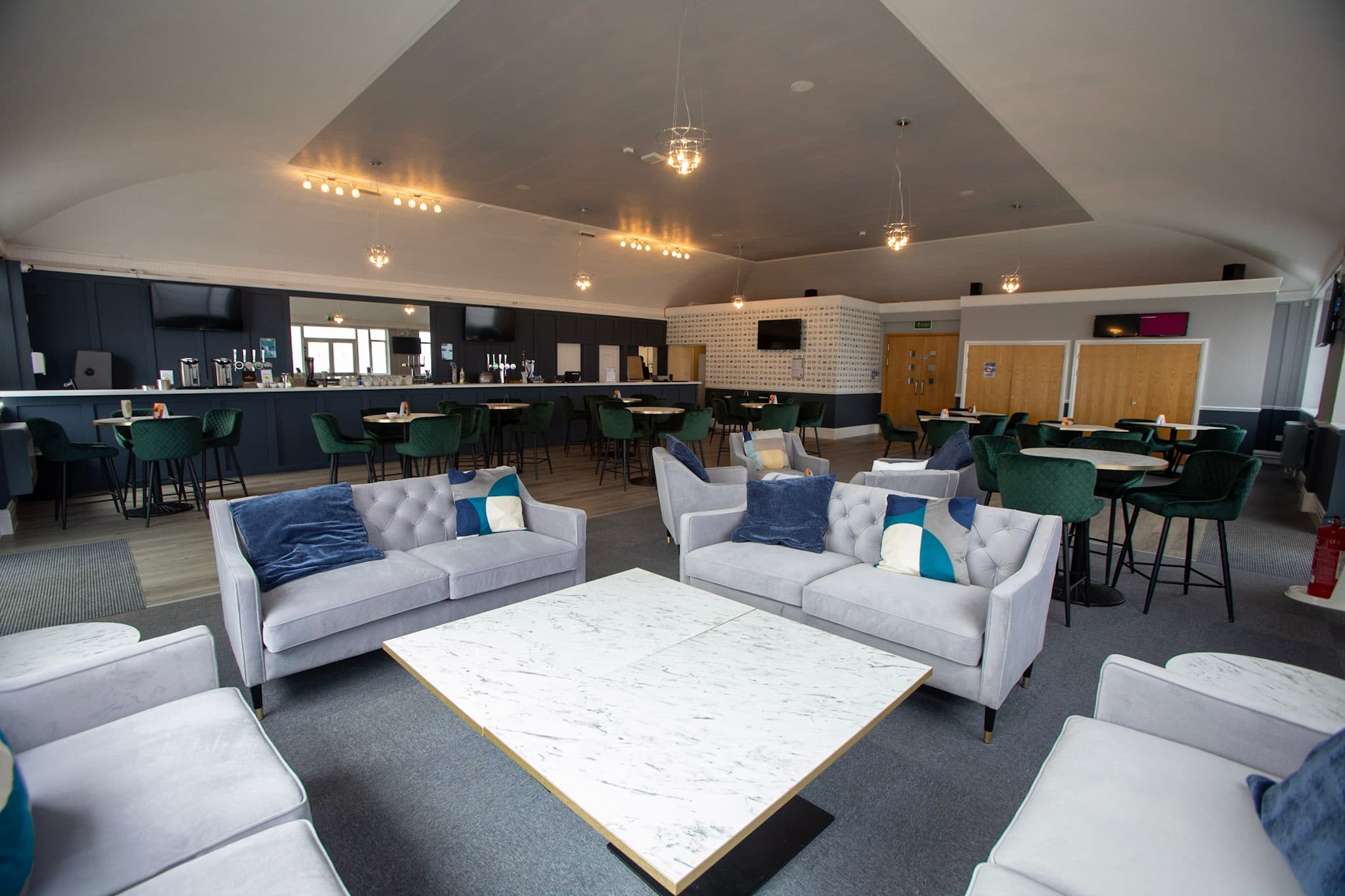 Lounge area with grey velvet sofas