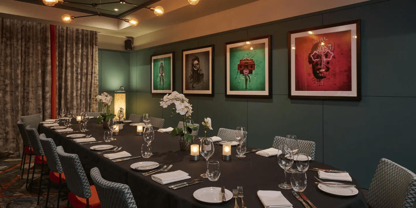 Private dining room at Malmaison Reading with long table set for a formal dinner