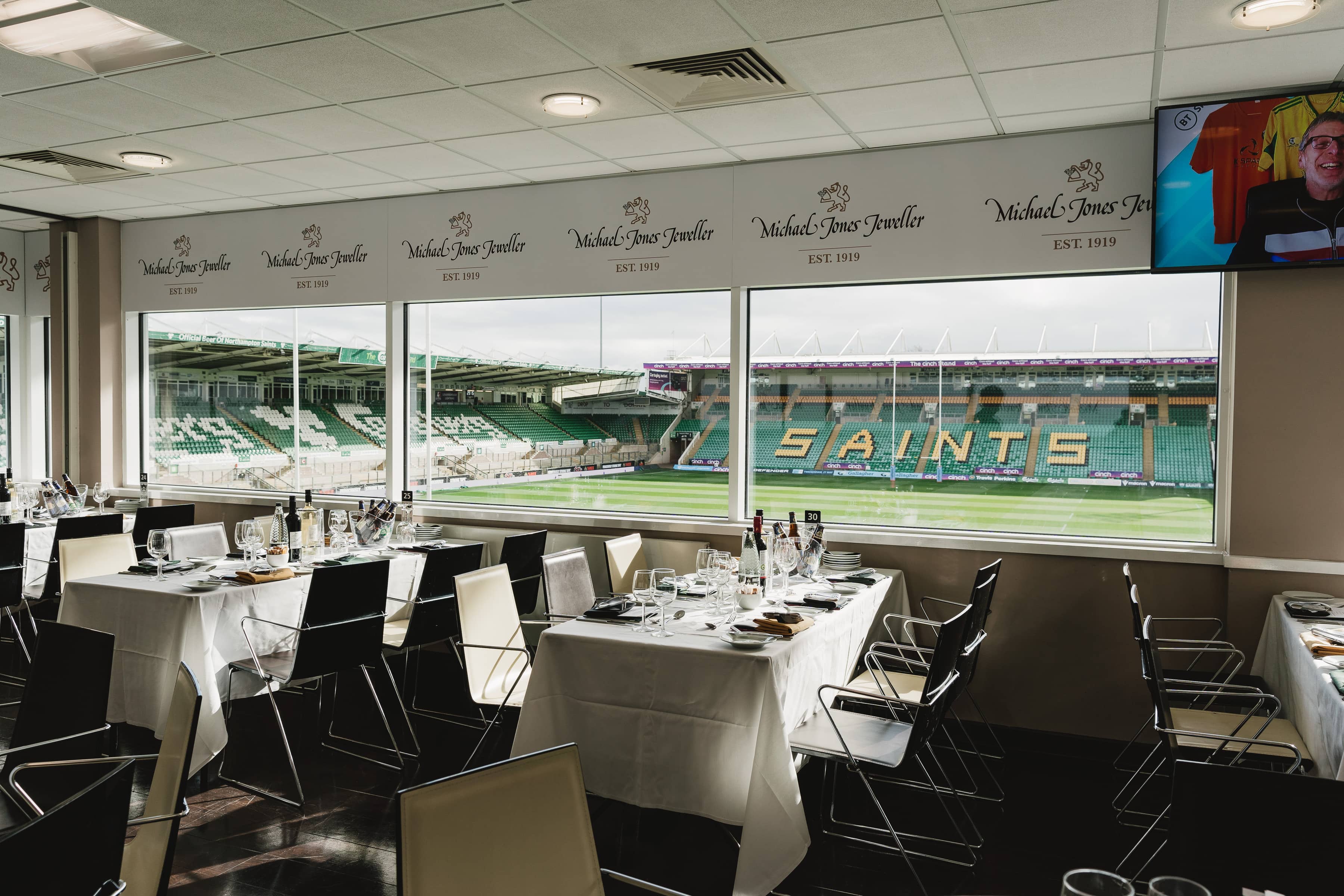 Hospitality dining room overlooking the pitch and stands at Franklin's Gardens.