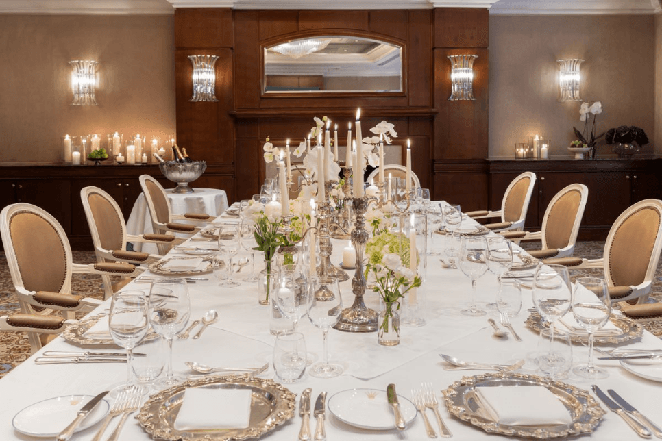 Private dining room at Rubens at the Palace laid for a formal candlelit dinner