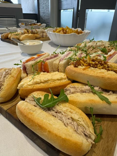 A buffet spread of filled rolls, club sandwiches and chips at Skylark Country Club.