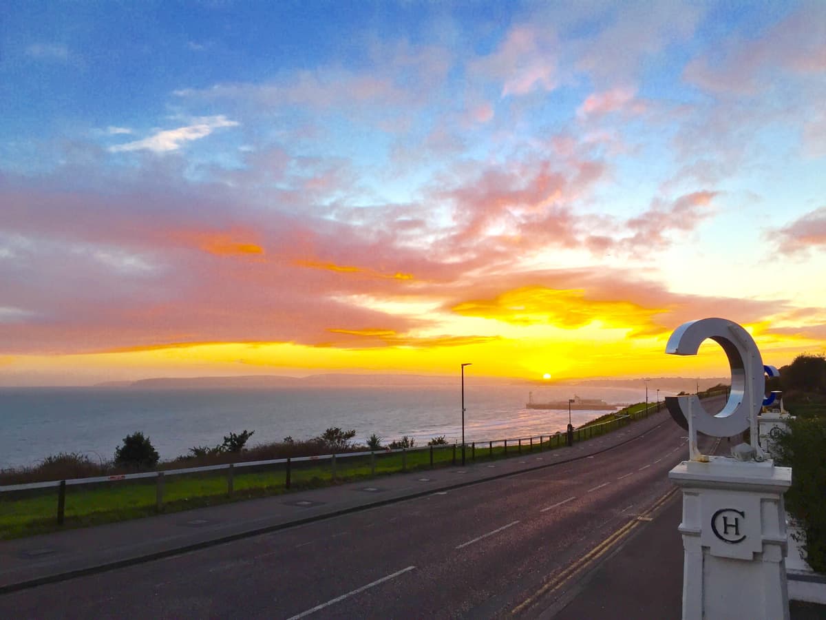 Sunset view over Bournemouth Bay from the Cumberland Hotel entrance gates.