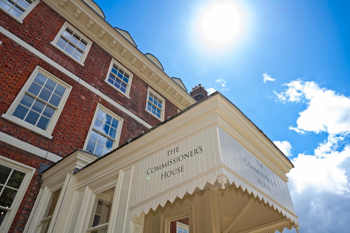 Upward view of The Commissioner's House exterior at the Historic Dockyard Chatham on a sunny day.