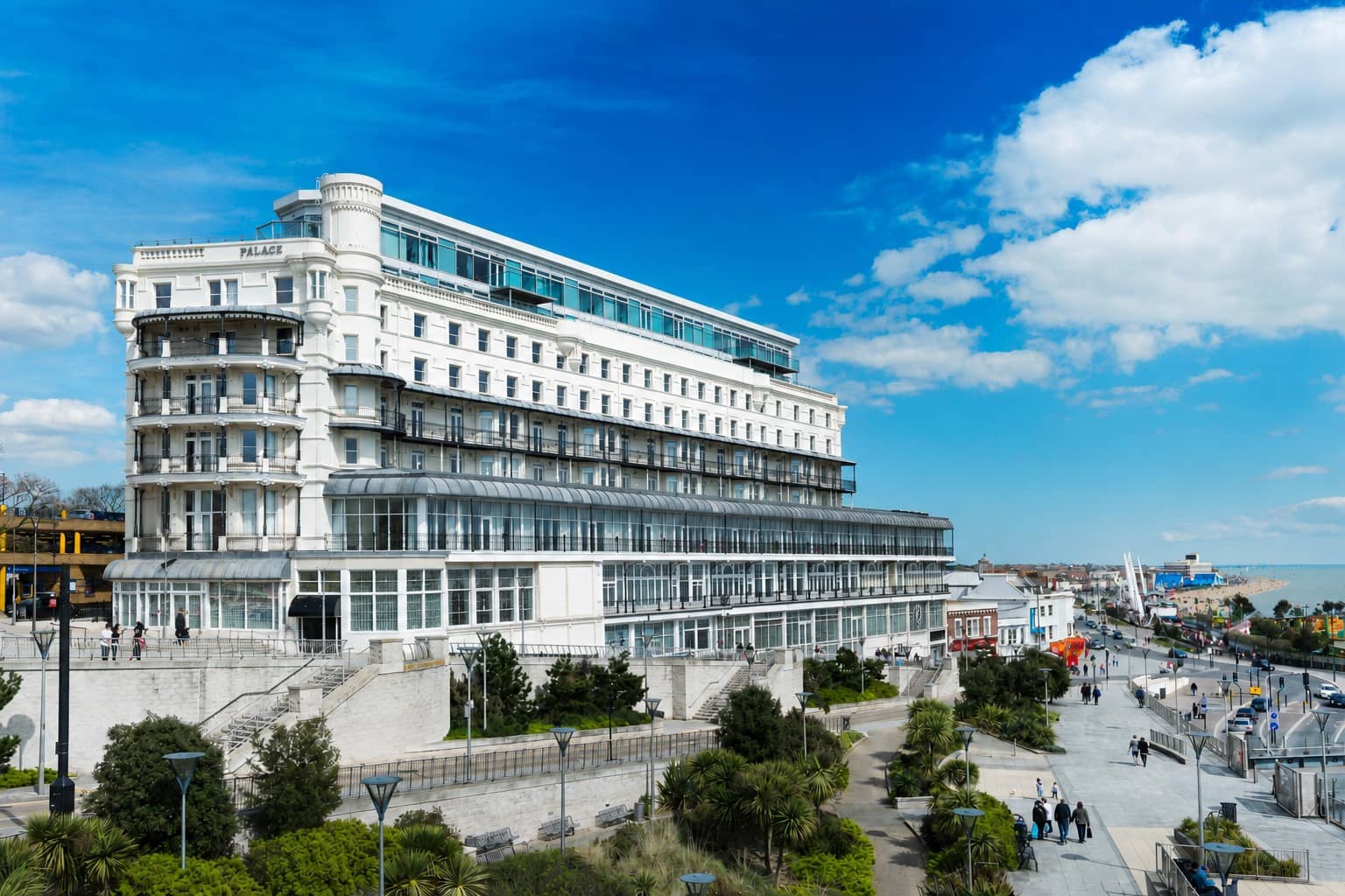 Exterior view of The Palace Hotel overlooking Southend-on-Sea seafront promenade under blue skies.