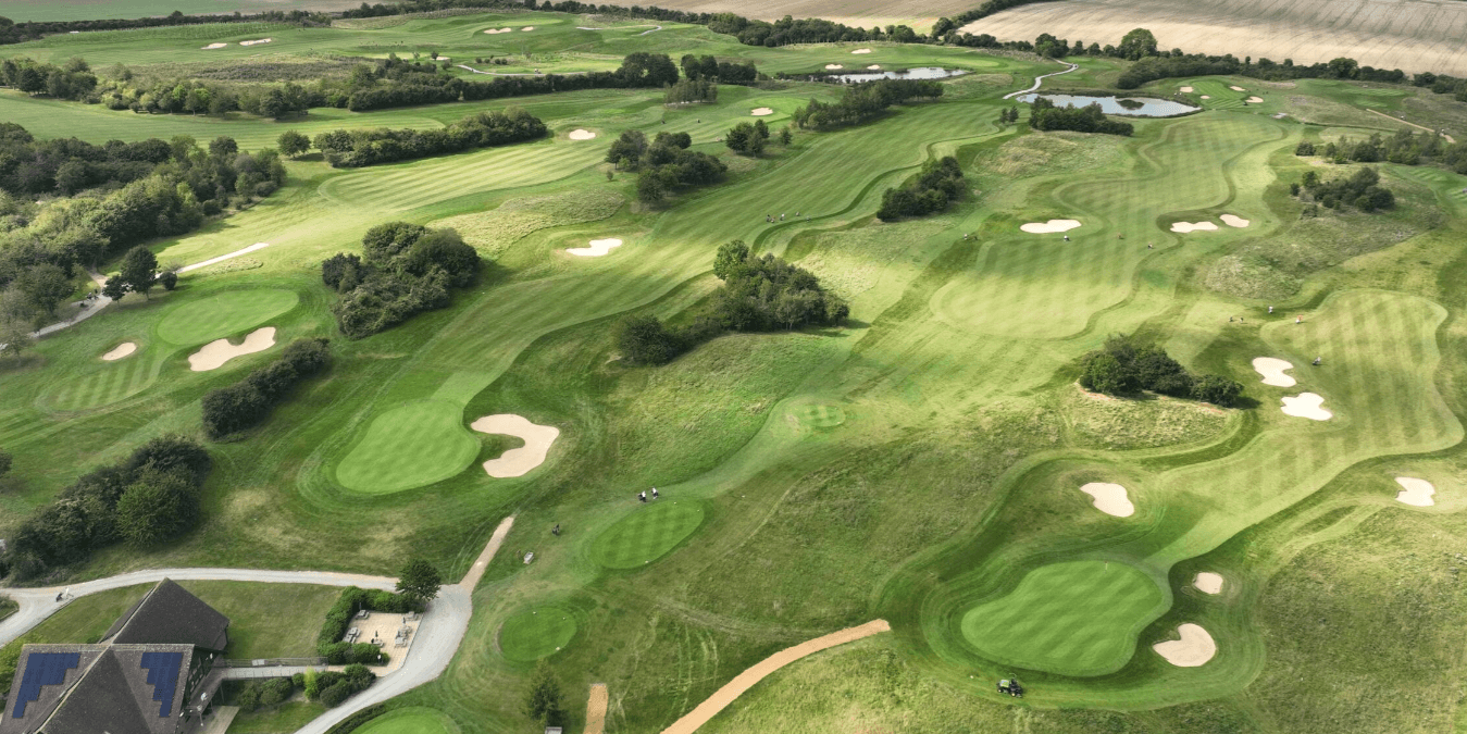 Aerial view of Weybrook Park Golf Club's course with sand bunkers and water features.